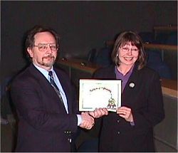 Photo: Outgoing Chair Doug McCann congratulating Past Chair Sharon
Parker  